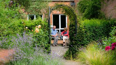 Couple relaxing in garden